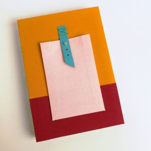 Cuaderno mochila naranja rojo